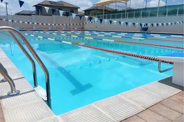 The swimming pool with lane ropes and bunting